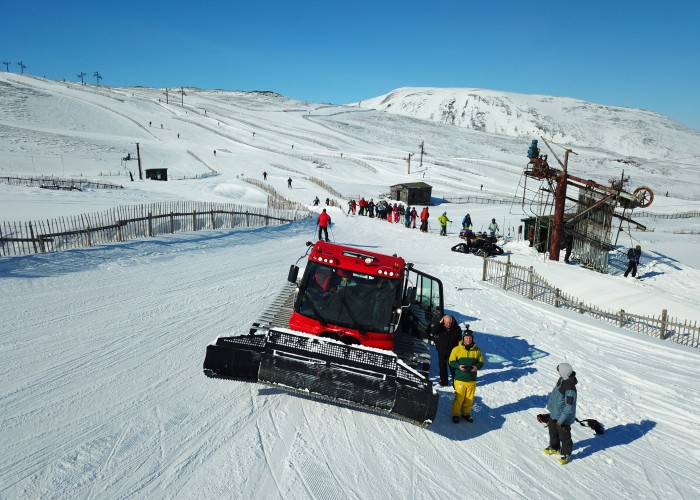 Meal Odhar and Cluny Meal Odhar runs with red Pisting machine in foreground Mountain Info